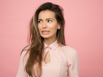 woman wearing pink top