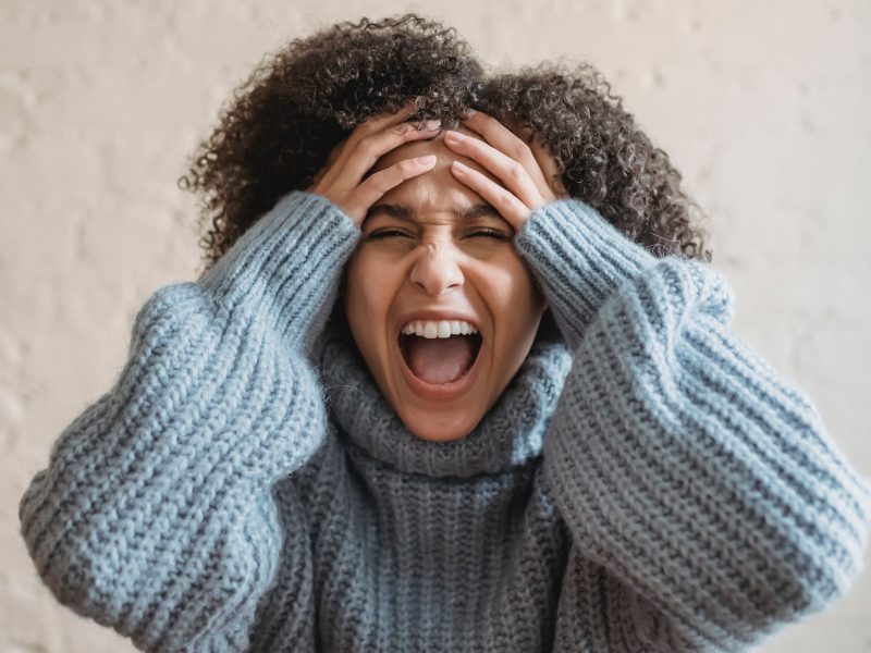 upset woman screaming in room