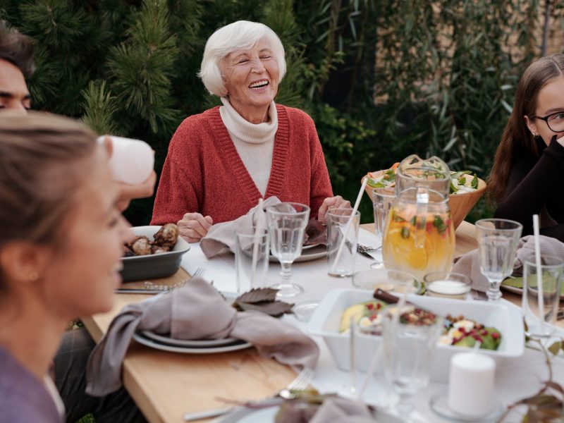 happy family enjoying dinner in garden