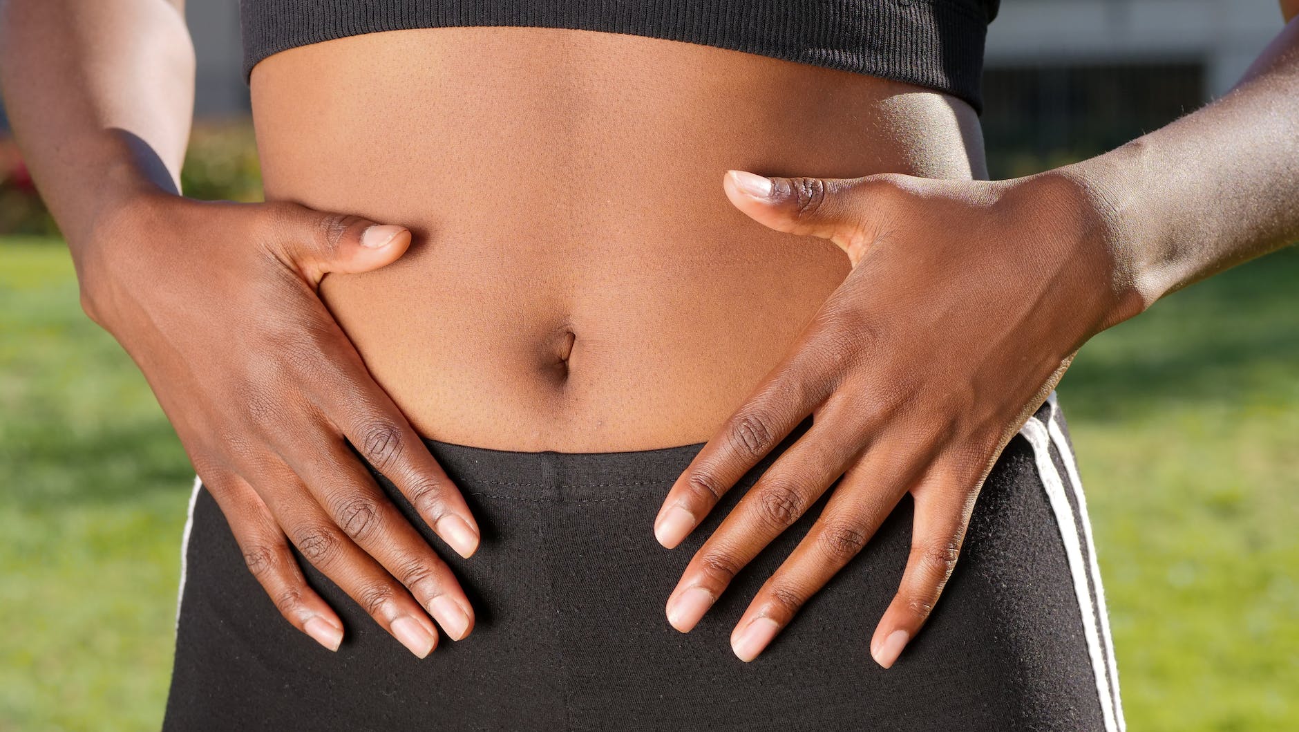 a person touching her belly